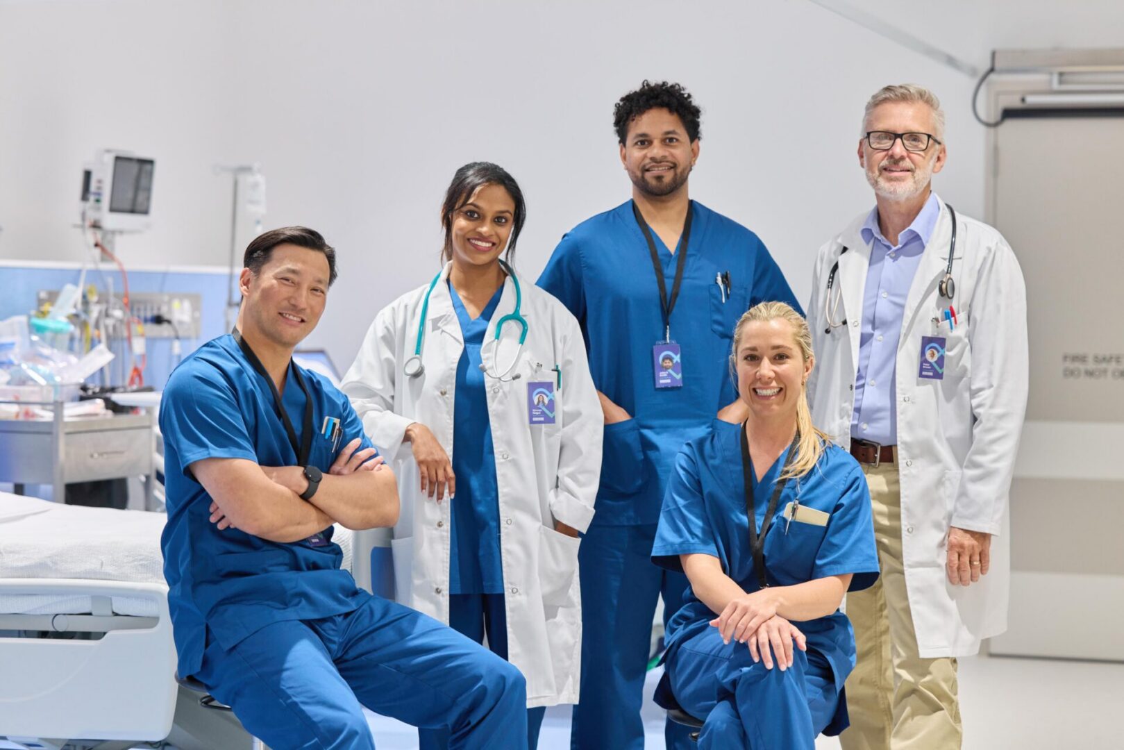 Medical team smiling in a hospital setting.