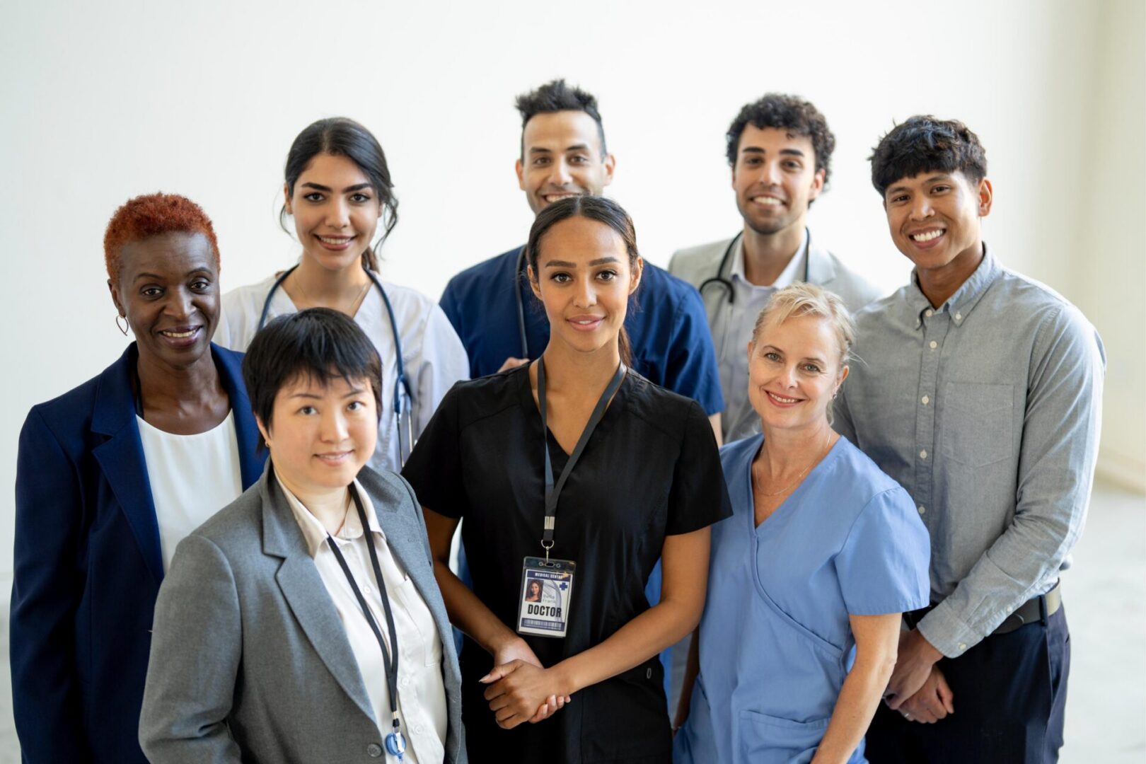 Diverse group of healthcare professionals posing together.