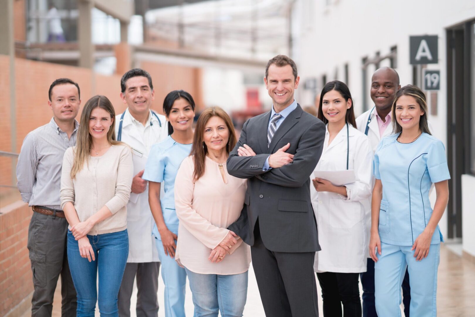 Group of diverse professionals in a hallway.